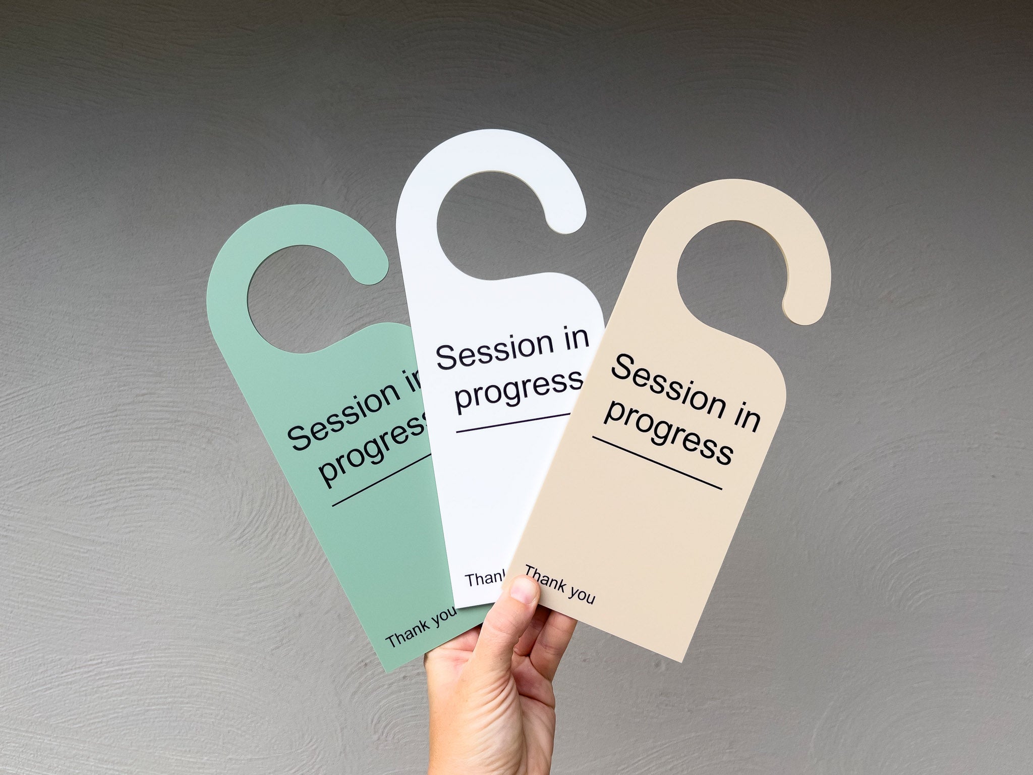 Set of 3 custom acrylic door hangers that read 'Session in progress' in sage, white and beige.