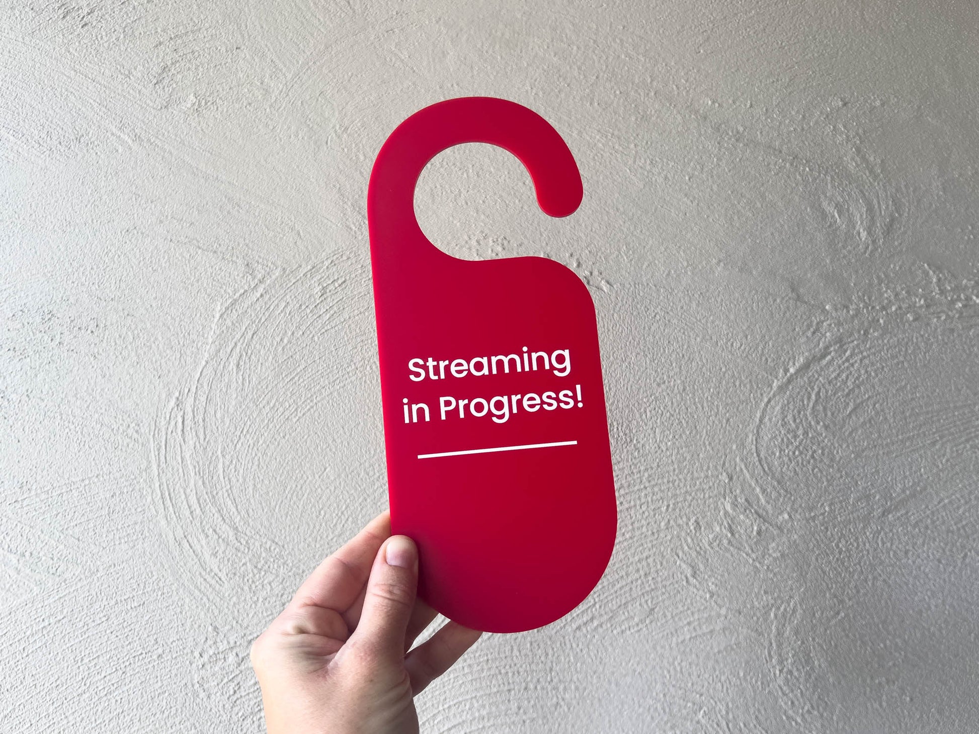Bright red custom door hanger displaying 'Streaming in Progress!'