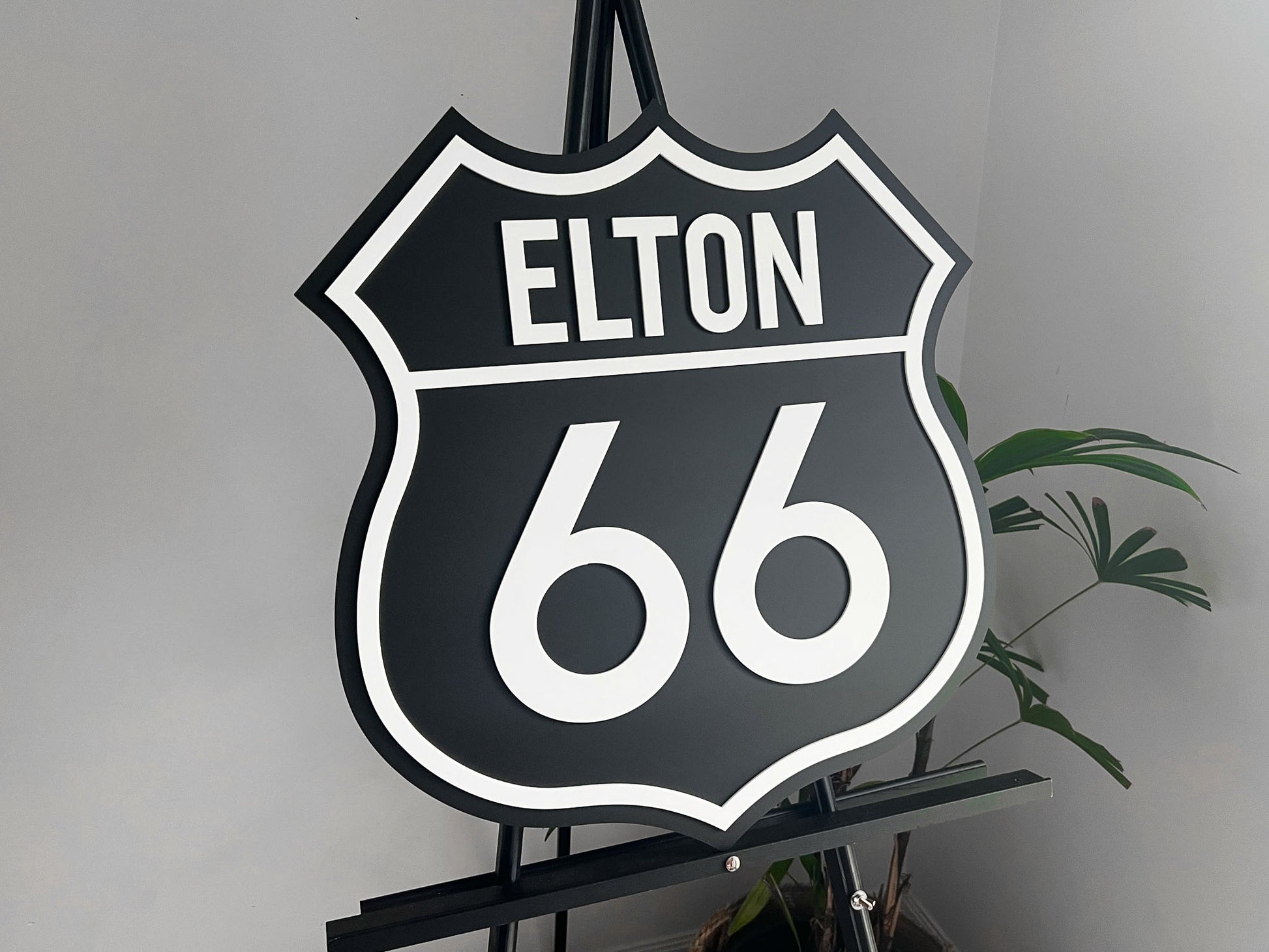 Classic highway style 3D acrylic sign that says 'ELTON 66' in black and white