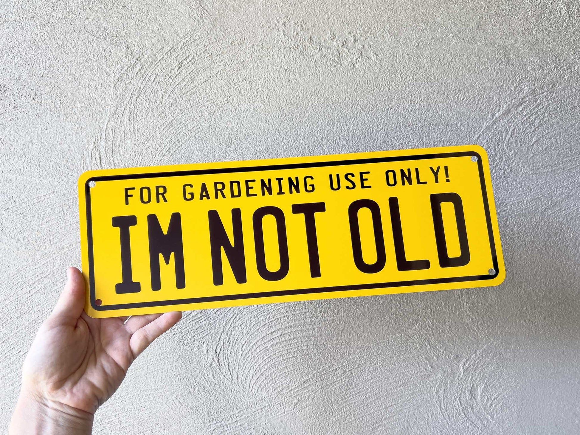 Custom printed yellow and black number plates style sign that says 'Im Not Old'.