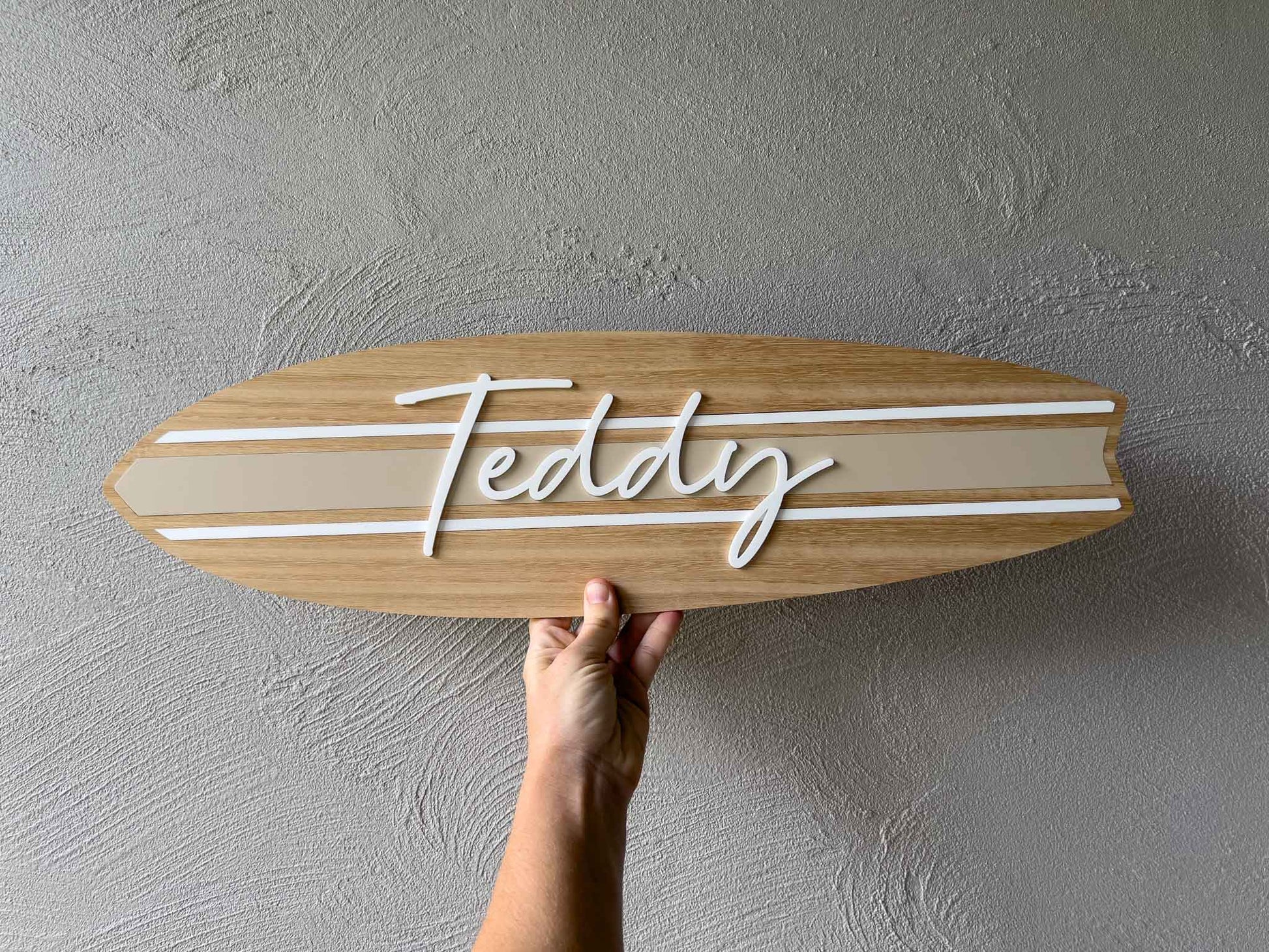 Custom timber surfboard with acrylic stripes with the name 'Teddy' in white 3D lettering | Coji Designs