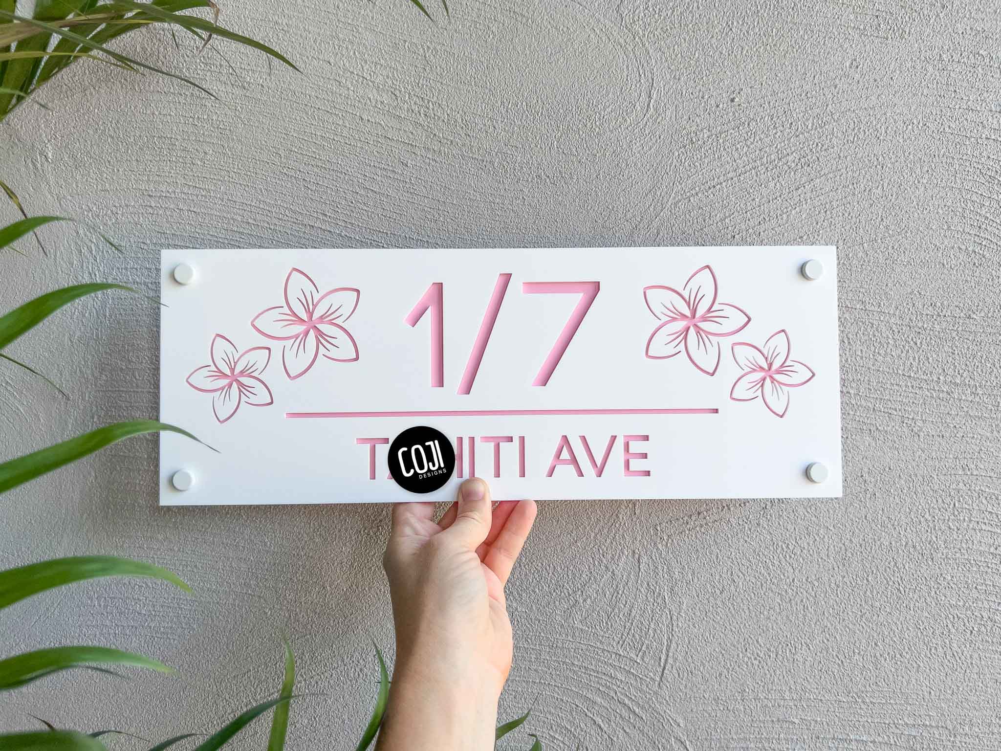 Personalised white and light pink franipani house sign with an address and four acrylic cut frangipanis