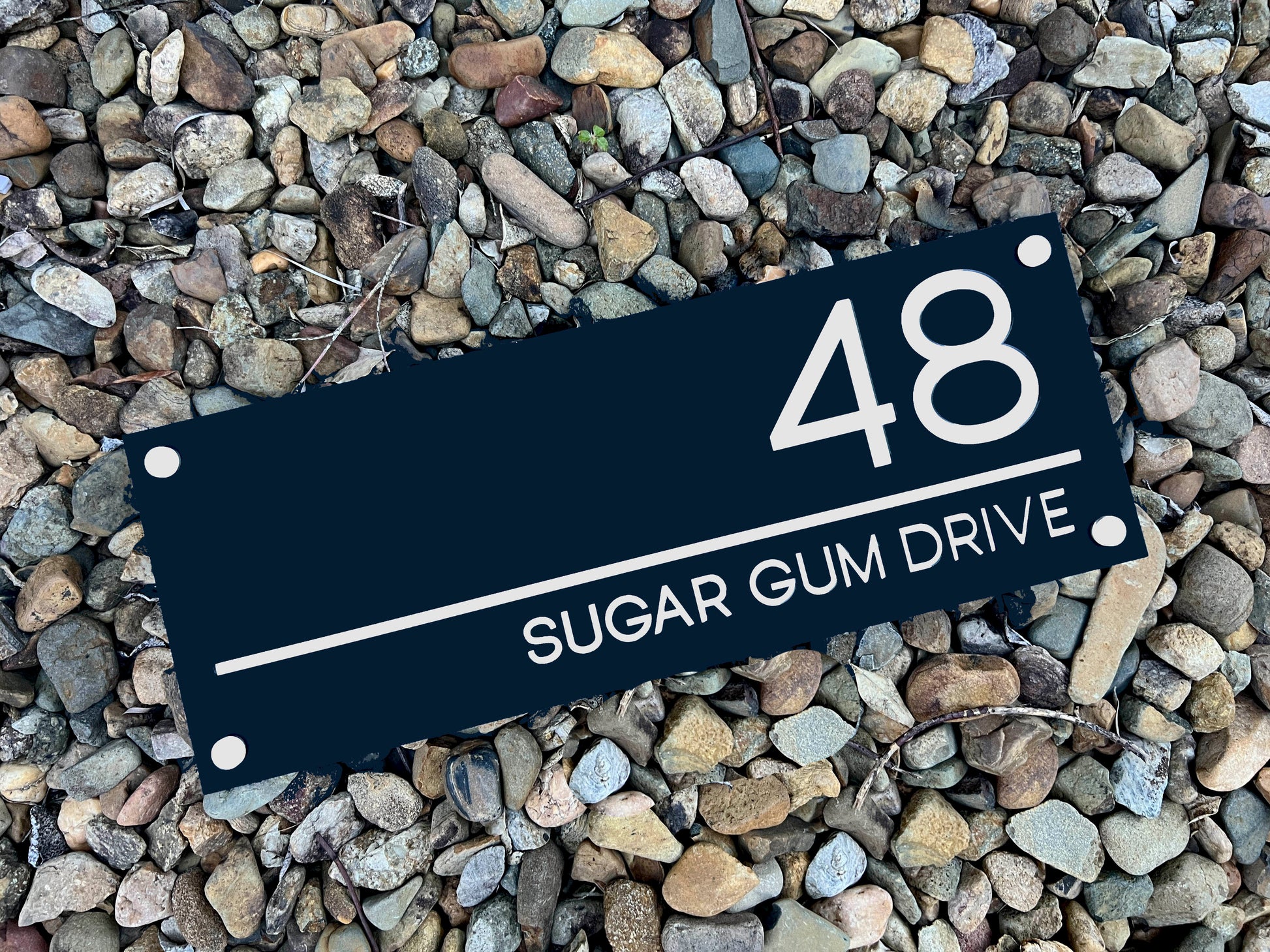 A deep blue charcoal and white colour acrylic handmade personalised house sign.