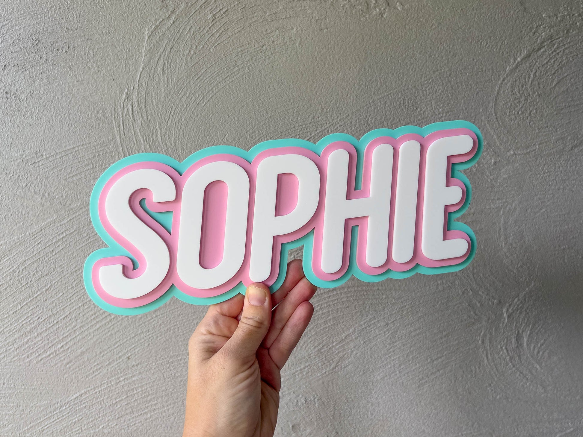 Triple layer block 3D name plaque with the name 'Sophie' in mint, pink and white.
