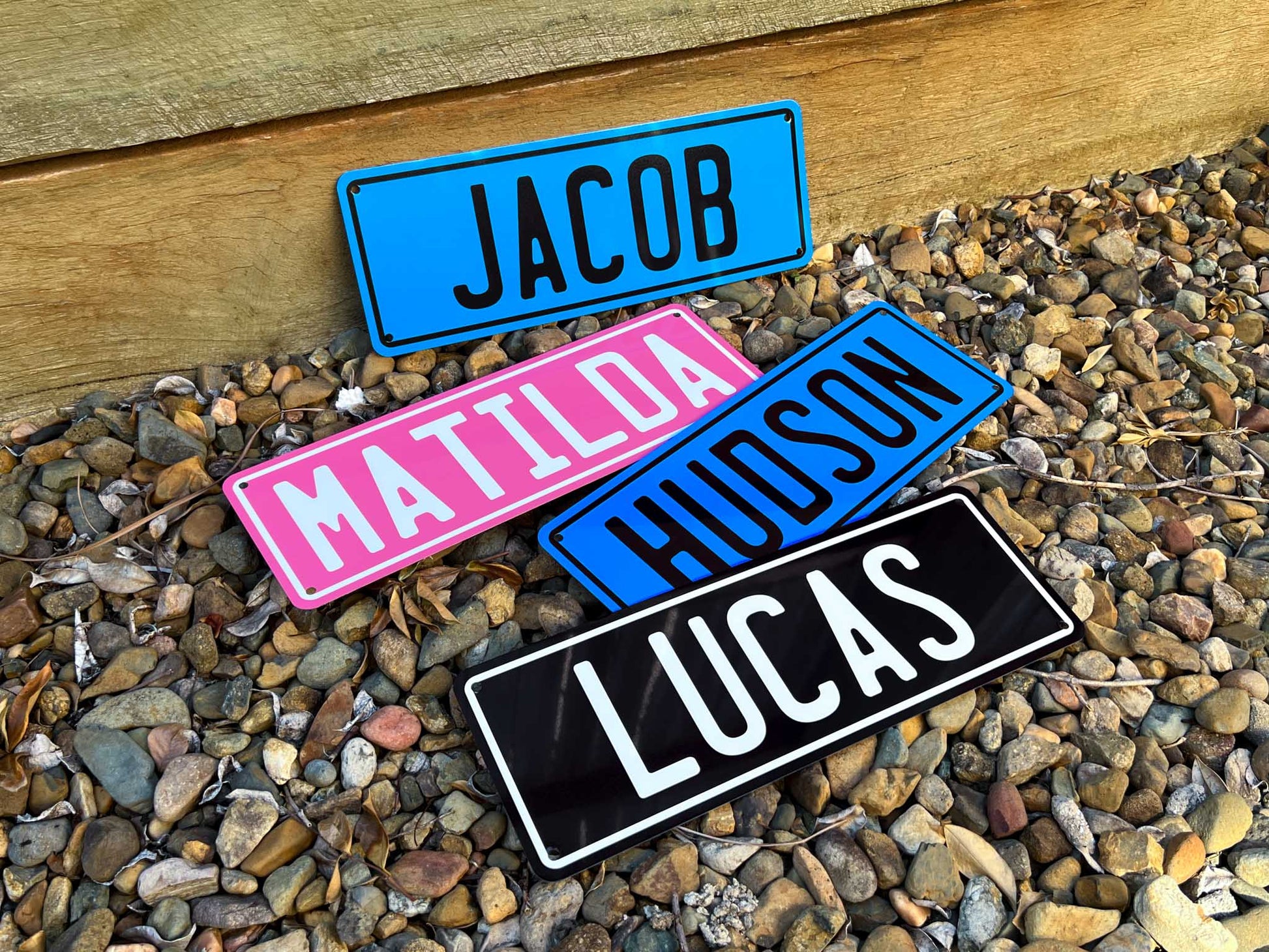 Classic number plate style name plates with Jacob, Matilda, Hudson & Lucas printed on them.