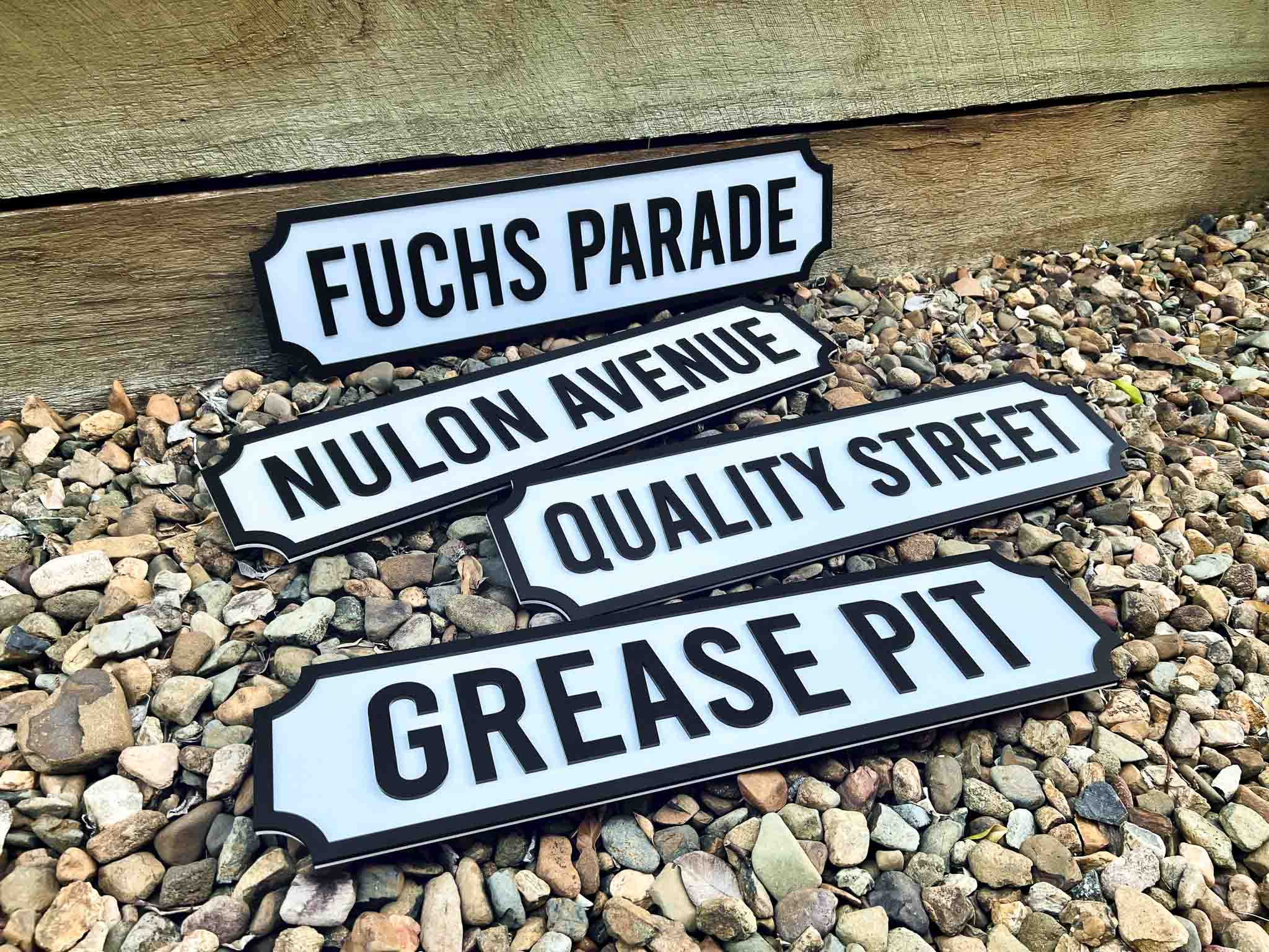 Classic vintage street signs for a workshop in black and white.