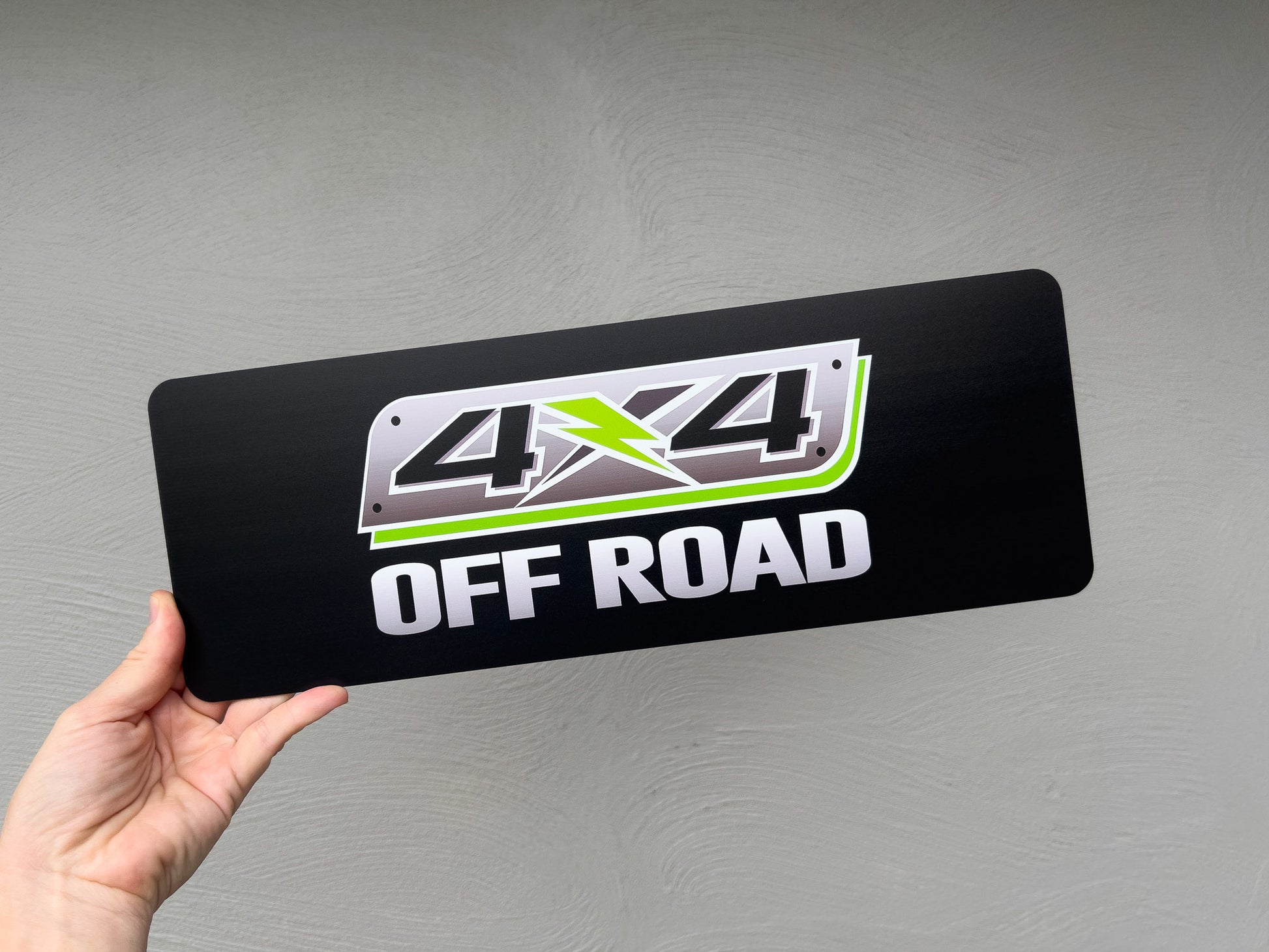 Custom printed flexible logo plates with the brand name '4x4 Offroad' printed on it.