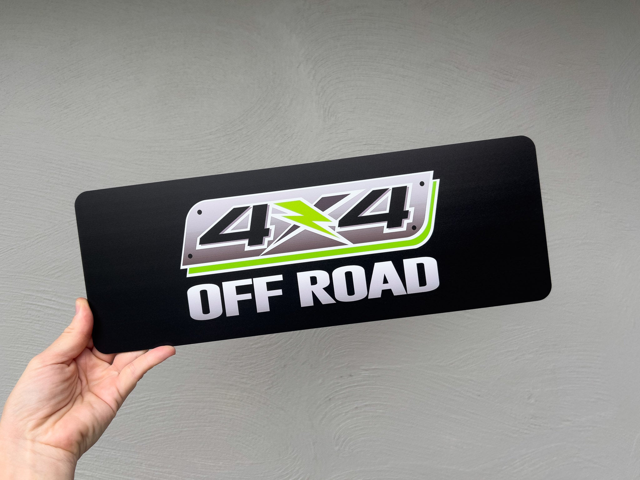 Custom printed flexible logo plates with the brand name '4x4 Offroad' printed on it.