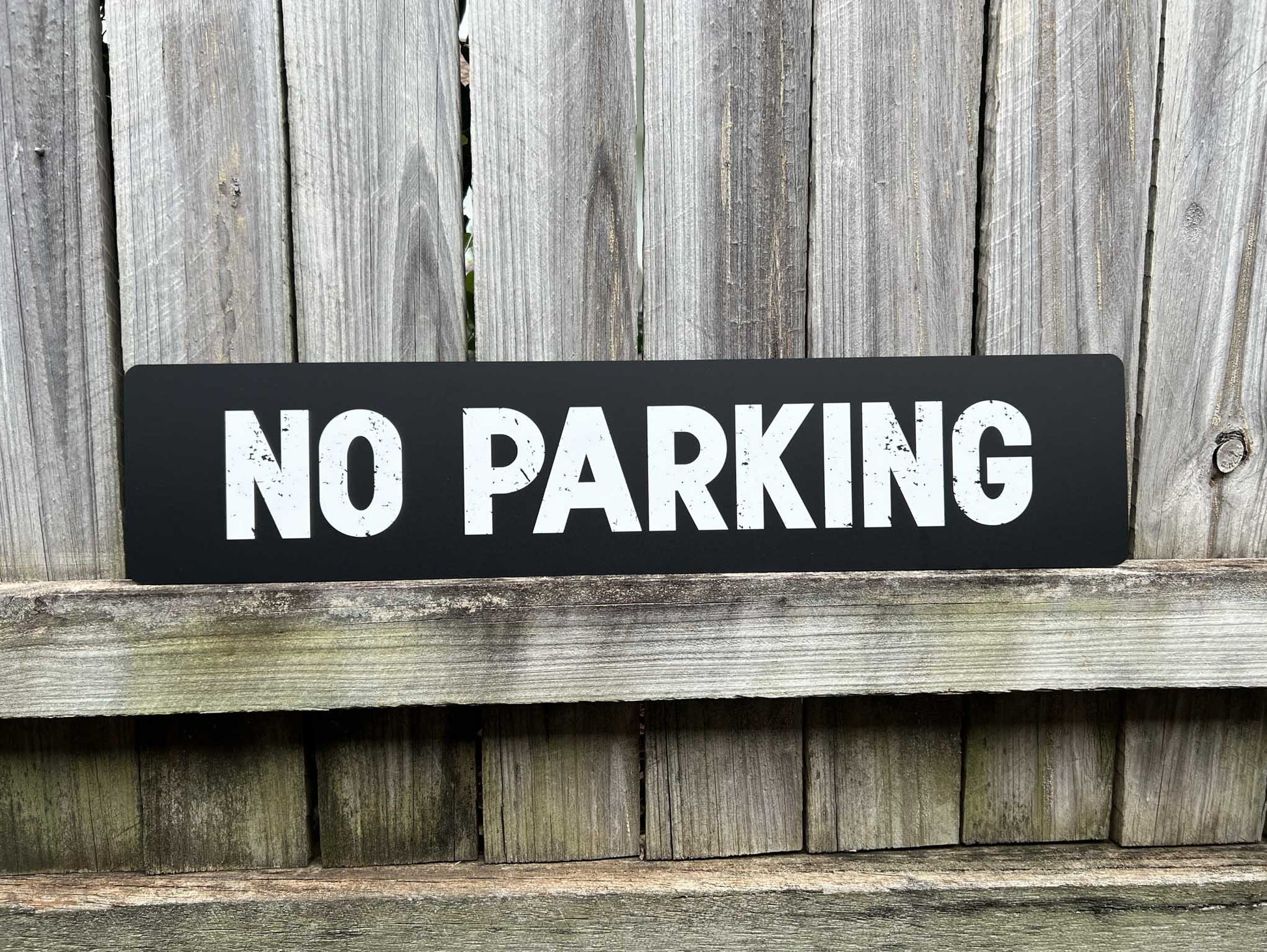 Rustic weathered personalised text sign that reads 'NO PARKING' for a retro vintage style wall art piece. 