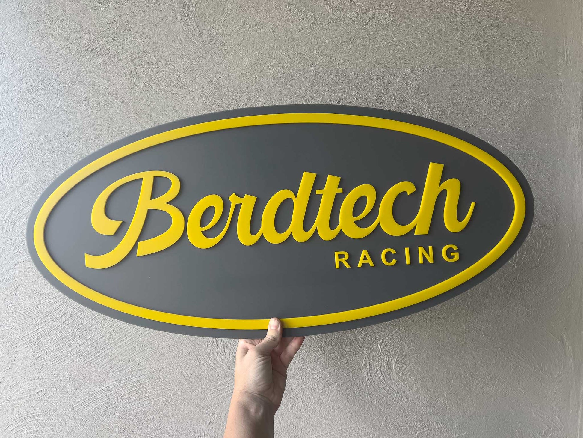 Classic personalised oval sign with 'Berdtech Racing' in grey and yellow