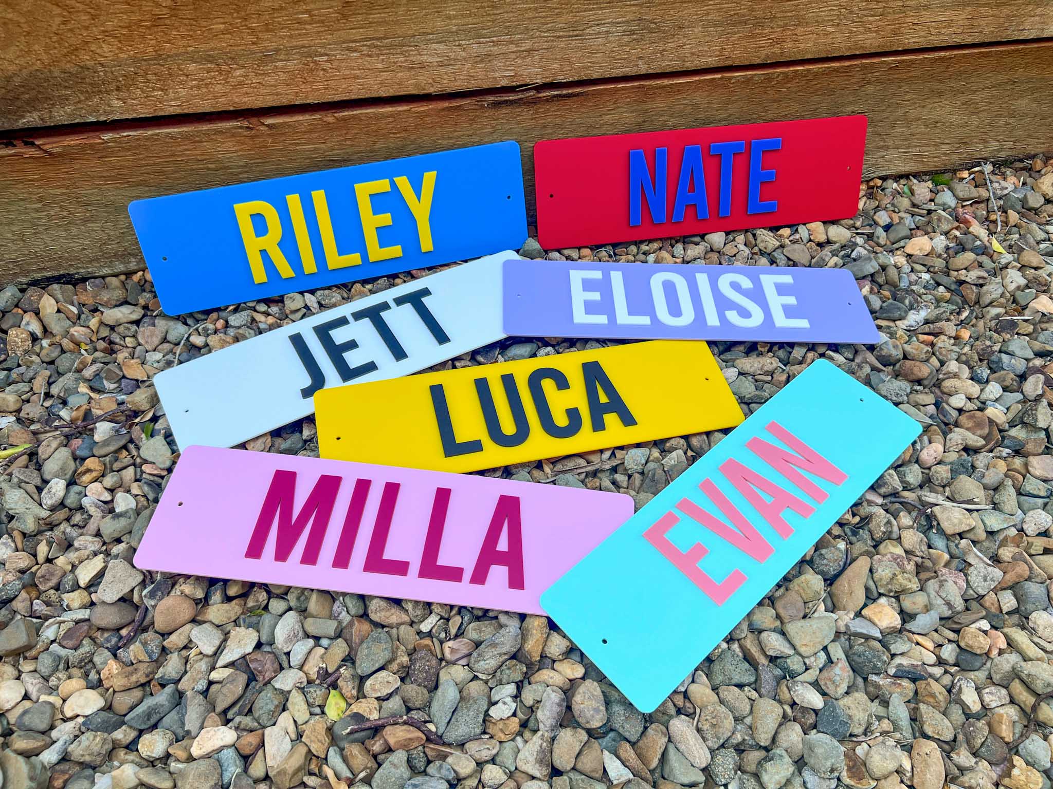 Colorful nameplates laser cut name in multicolours.