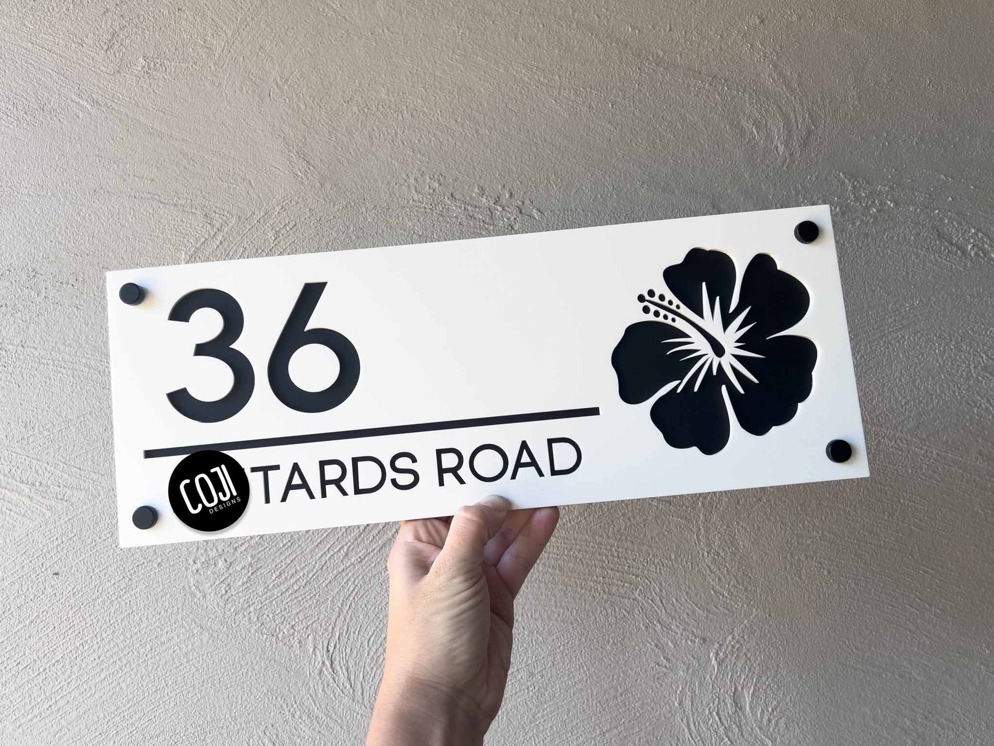 Custom made white and black hibiscus floral design house sign with the number '36'.