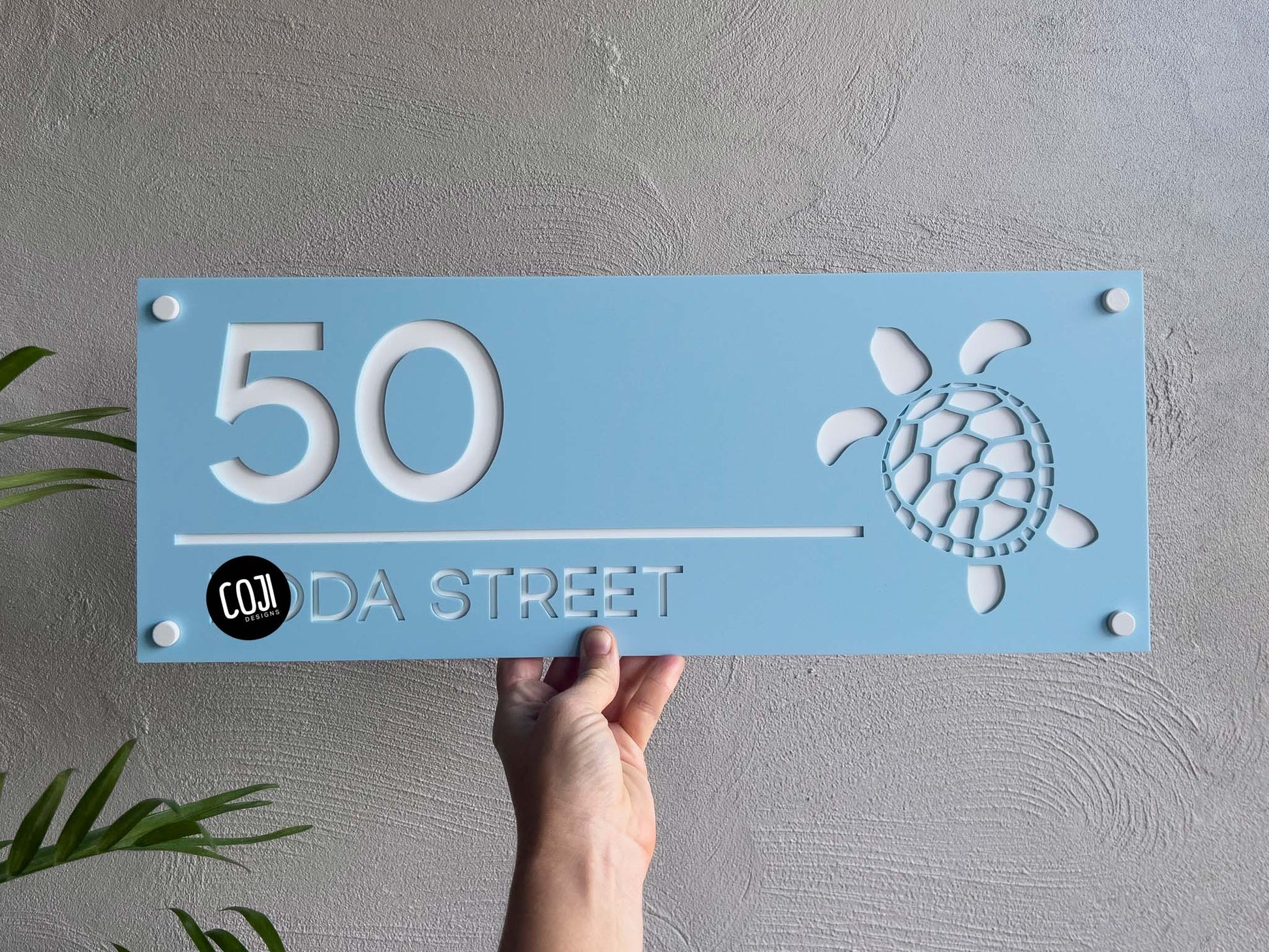 Personalised laser cut 3D acrylic light blue and white sea turtle address sign with the number '50'.