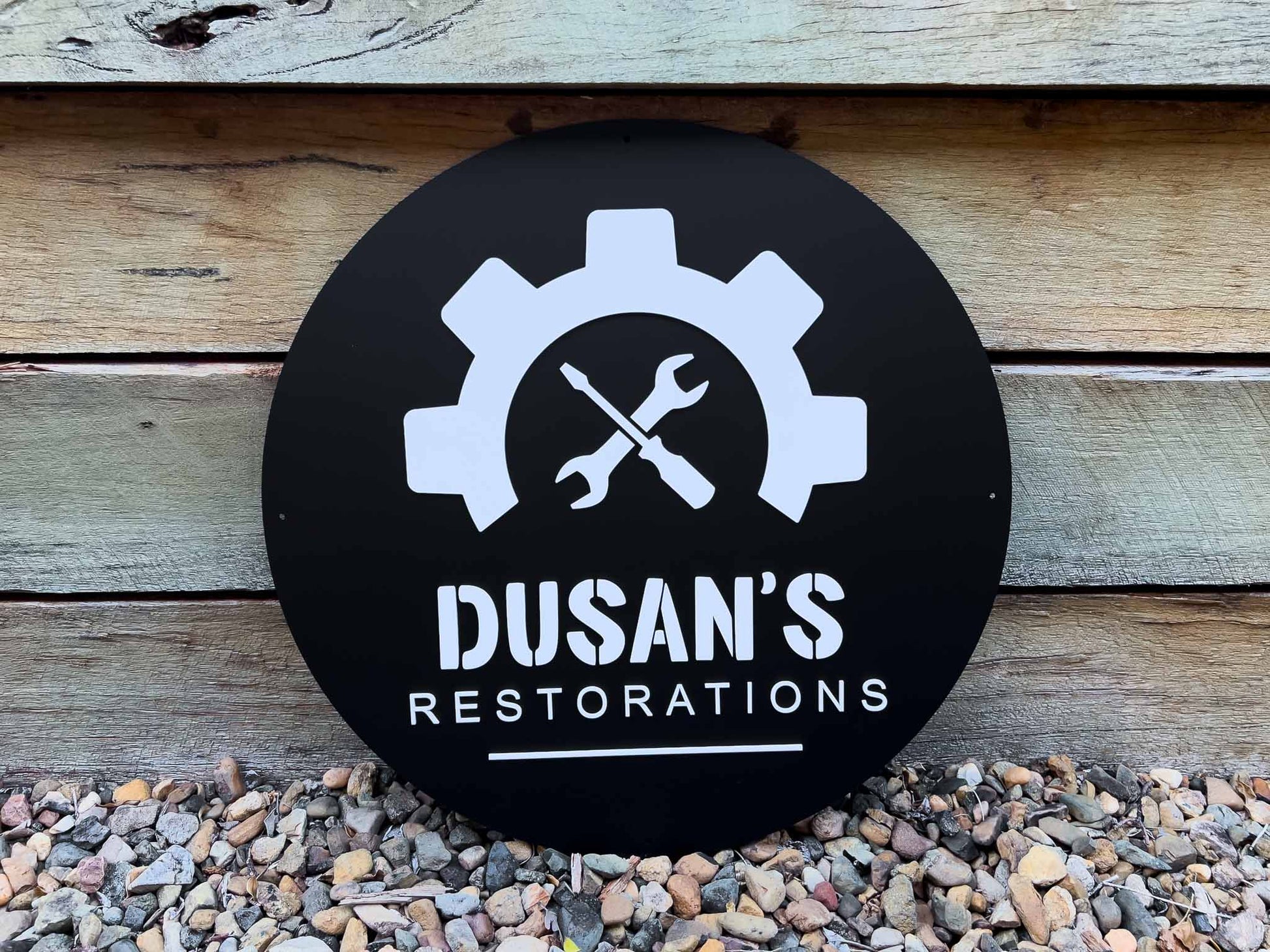 Custom restorations sign that says 'Dusan's Resortations' custom made in black and white.