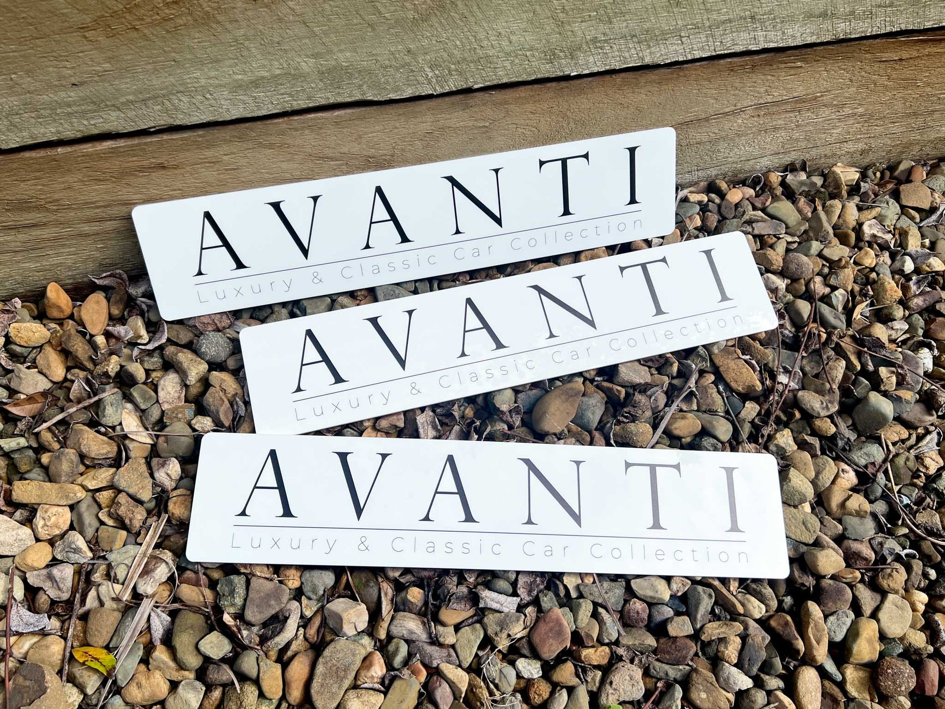 Three 'AVANTI' brand Euro logo plates UV printed in black on a white acrylic plate.