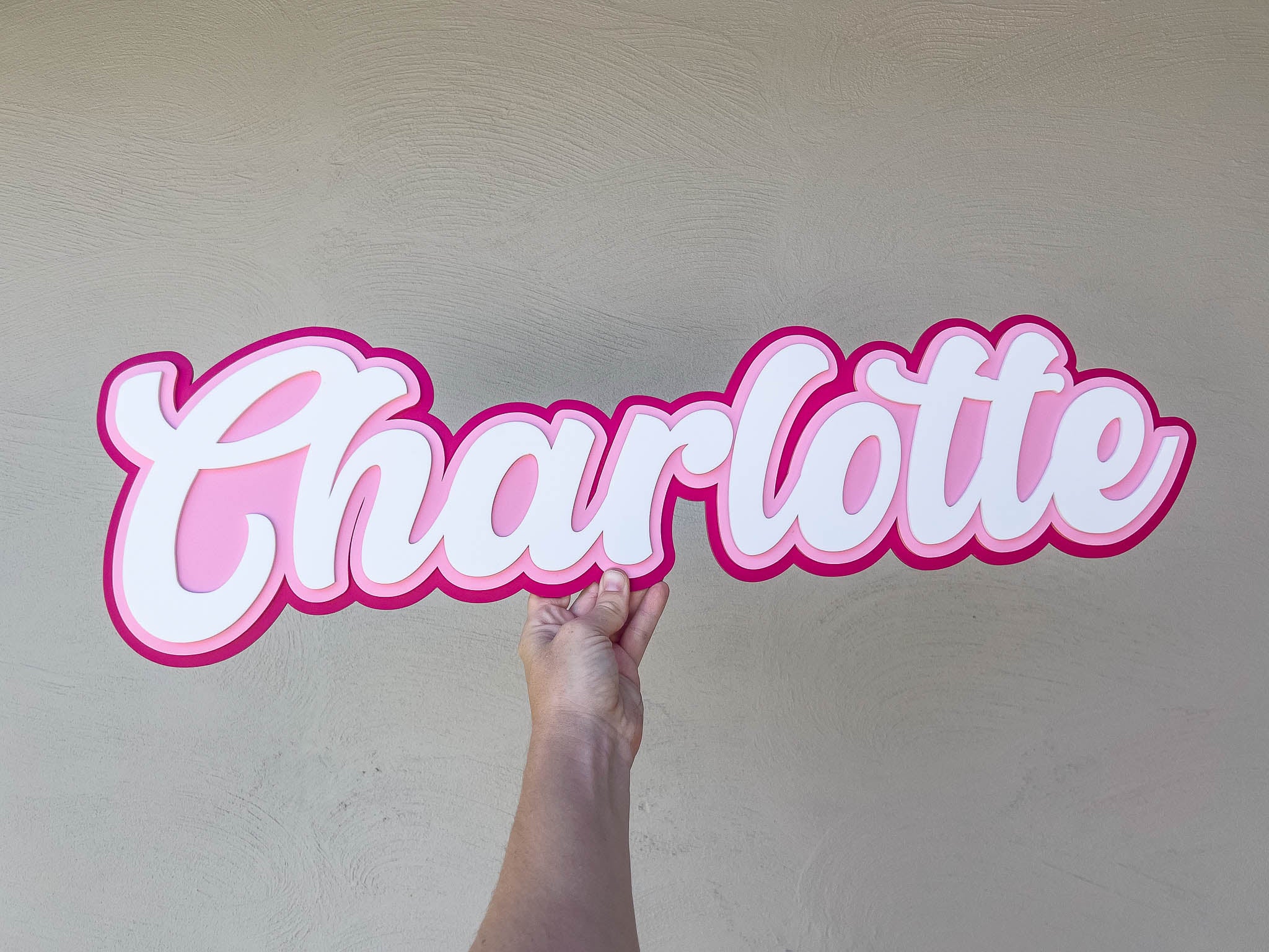 Classic 'Charlotte' 3D layered name plque in dark pink, light pink and white.