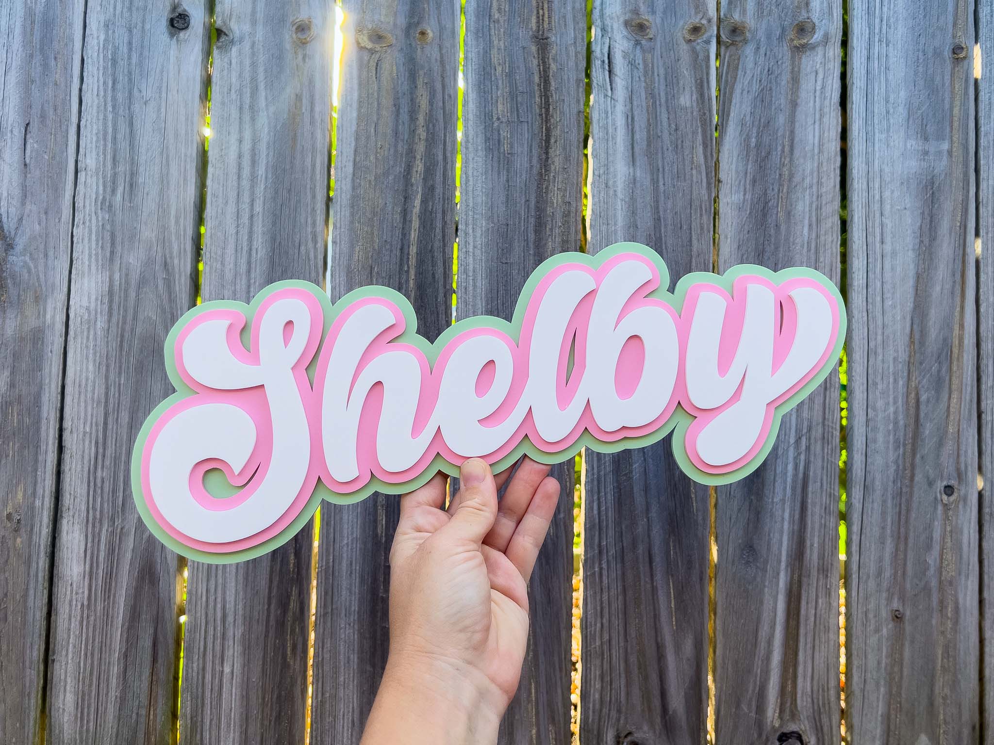 Iconic 90s wall art custom name plaque 'Shelby' in pastel green, pink and white.