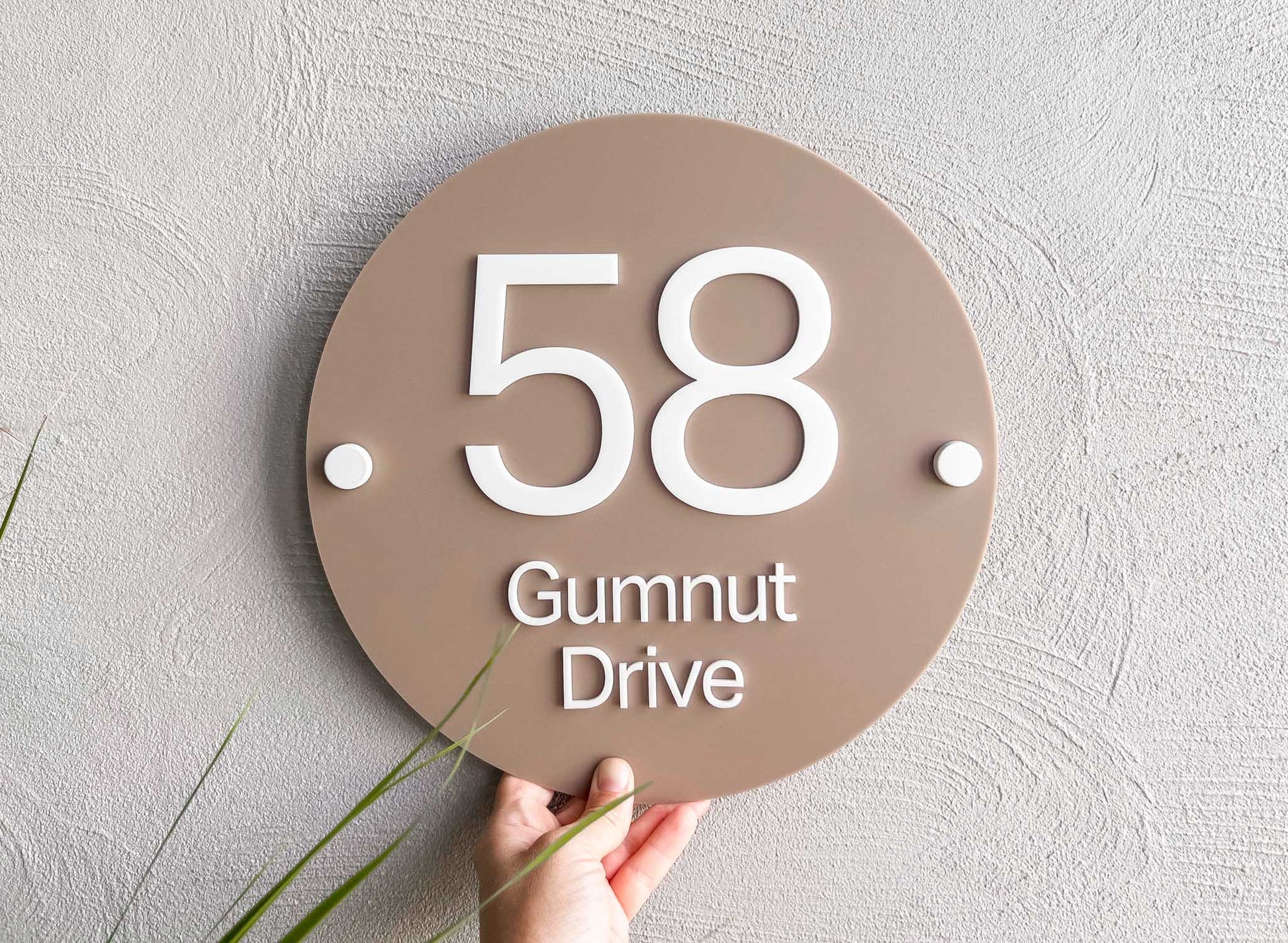 Classic light brown and beige custom 3D acrylic street address sign that says '58 Gumnut Drive'.
