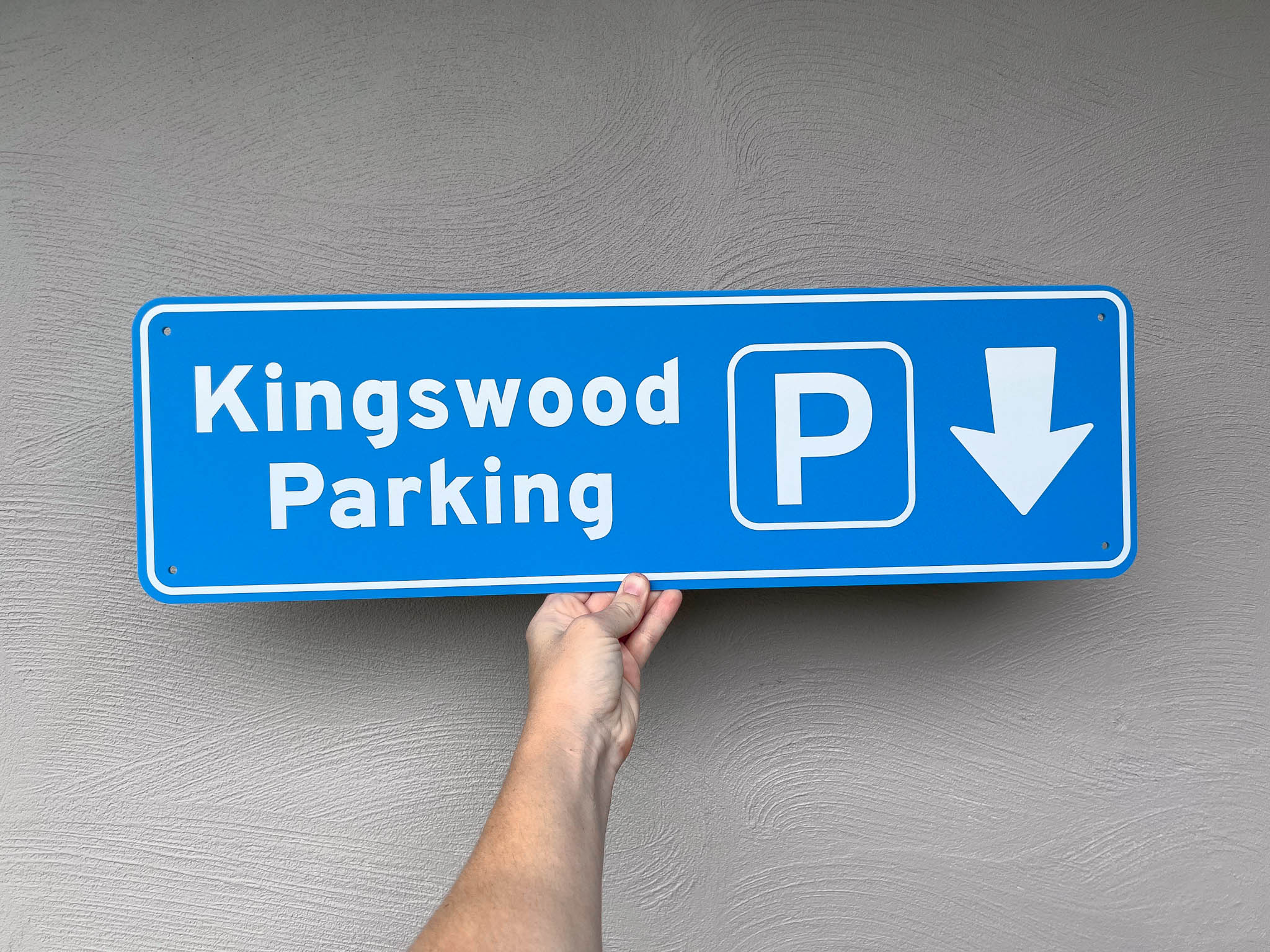 Novelty parking street sign that reads 'Kingswood Parking' in a coastal blue colour.