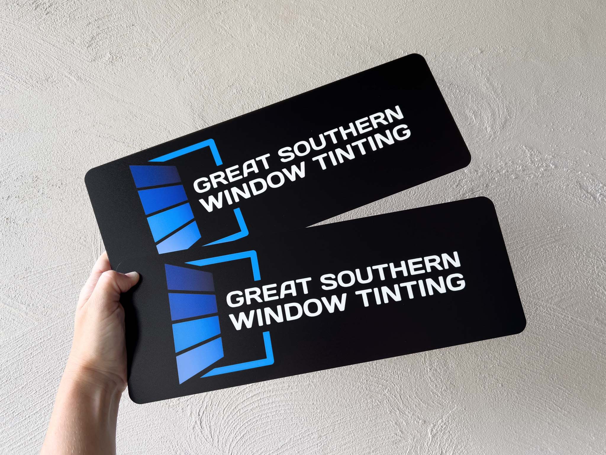 Two plate acrylic logo plates with a window tinting logo UV printed onto them