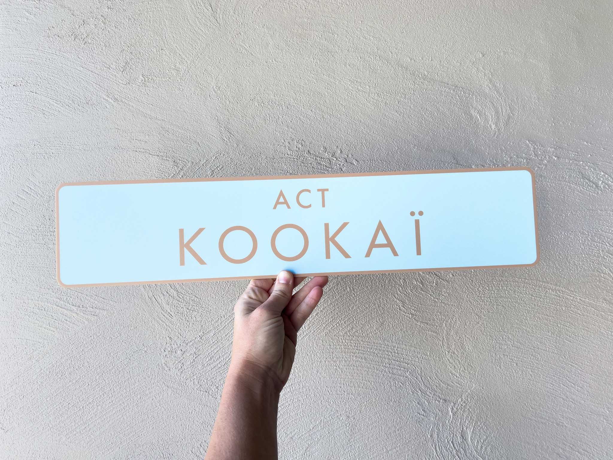 Custom printed Euro logo plate with the brand name 'Kookai' on it