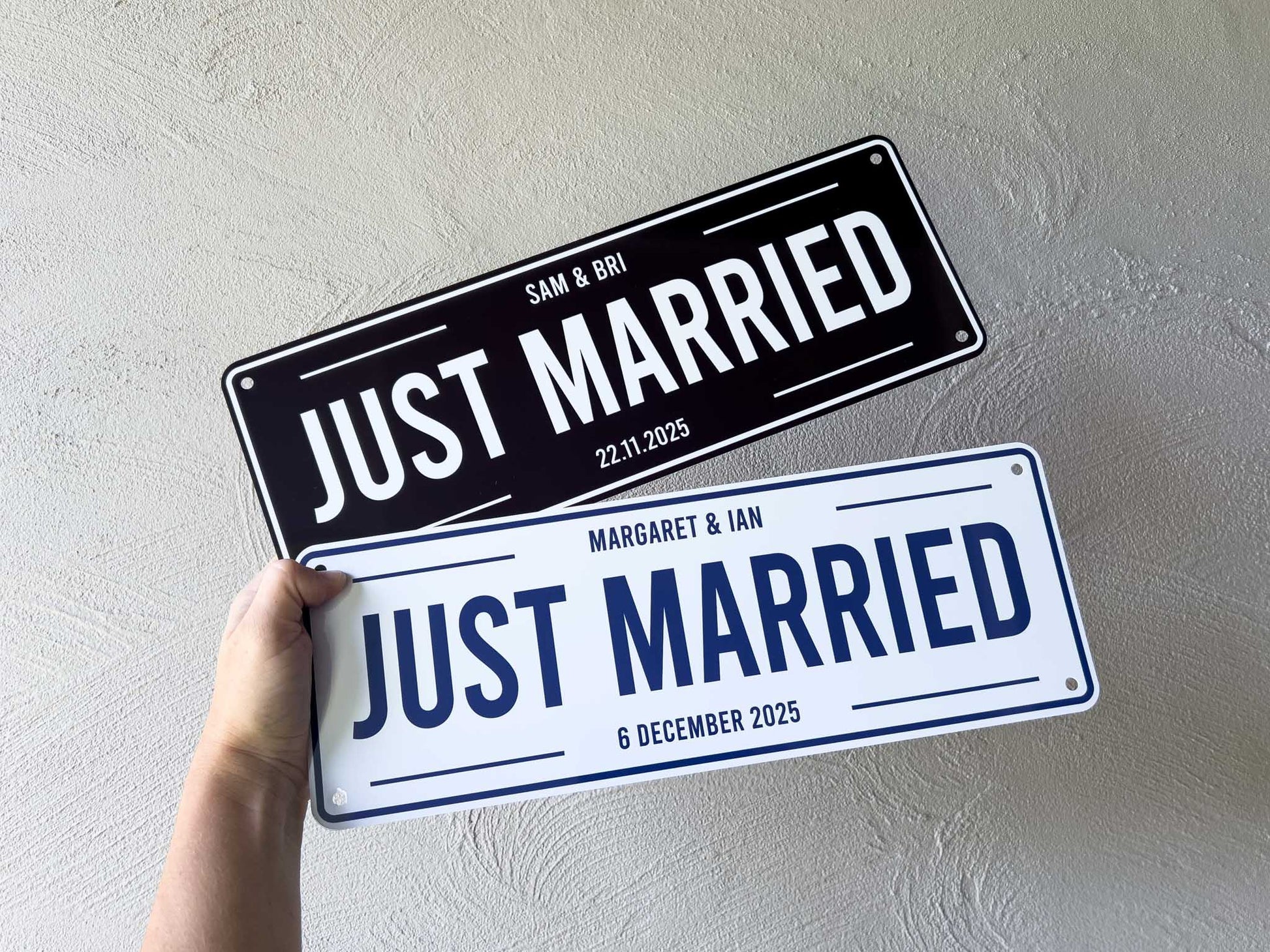 Two 'Just Married' signs held against a light gray background | Coji Designs