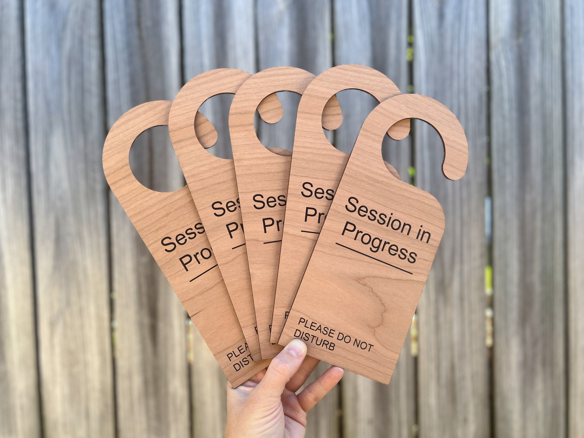 Personalised wooden UV printed timber door hangers for boutique studios and clinics | Coji Designs